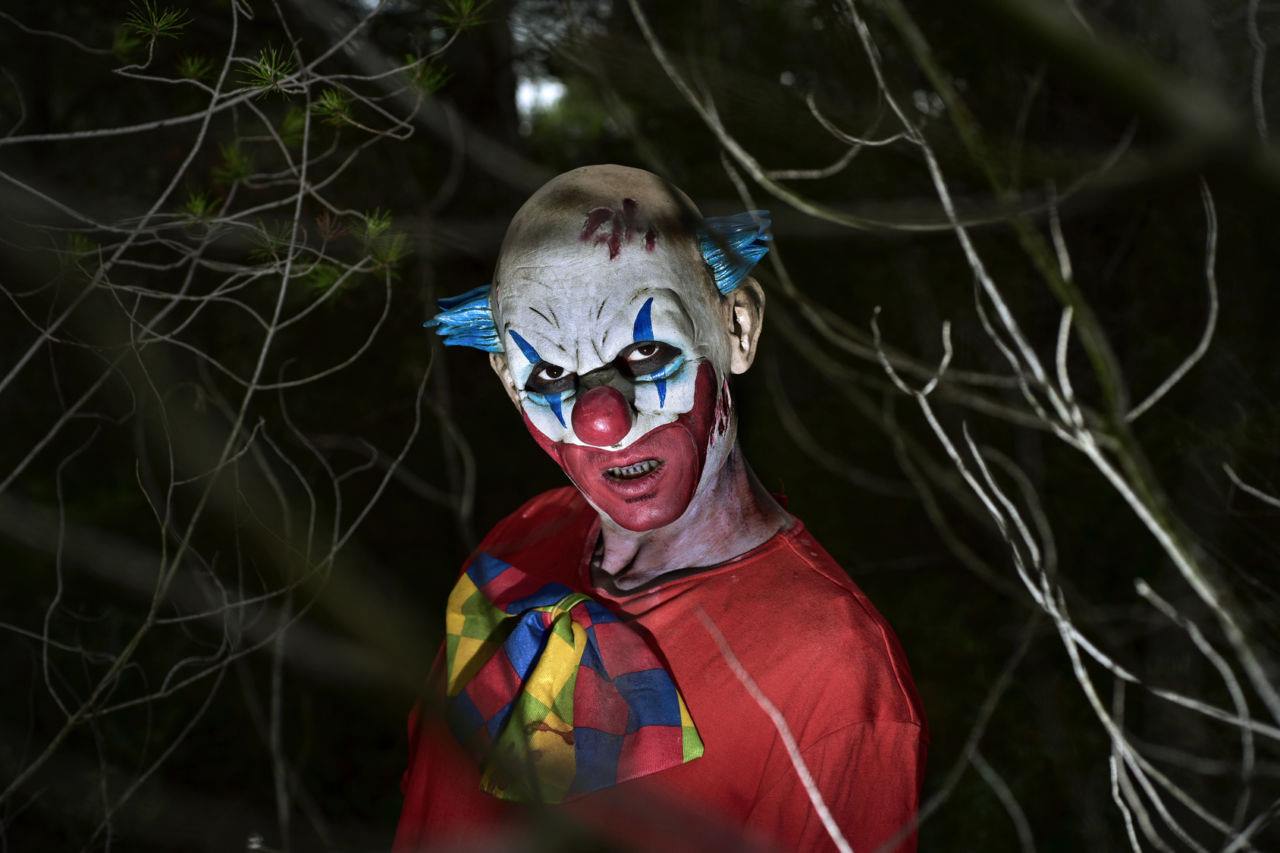 horror clown scary evil clown in the woods